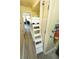 Bunk room with built in bunks, white ladder and coastal decor at 1300 Ocean Blvd # 139, Isle of Palms, SC 29451