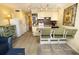 Kitchen with bar seating, white appliances, and tiled backsplash at 1300 Ocean Blvd # 139, Isle of Palms, SC 29451