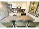 Kitchen with stainless steel appliances, eat-in bar, and decorative backsplash at 1300 Ocean Blvd # 139, Isle of Palms, SC 29451