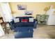Living room area with sleeper sofa, loveseat, and beach-themed artwork at 1300 Ocean Blvd # 139, Isle of Palms, SC 29451