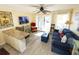 Open-concept living room with seating and access to the outdoor balcony at 1300 Ocean Blvd # 139, Isle of Palms, SC 29451