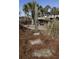 Outdoor shower at beach access with picnic tables and grill amidst palm trees at 1300 Ocean Blvd # 139, Isle of Palms, SC 29451