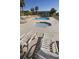 Outdoor pool area with chairs, loungers, and a hot tub at 1300 Ocean Blvd # 139, Isle of Palms, SC 29451