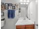 Bright bathroom boasts a single sink vanity and framed art at 1309 Basketweaver Way, Hanahan, SC 29410