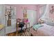 Pink bedroom showcasing a window, desk, and closet space at 1309 Basketweaver Way, Hanahan, SC 29410