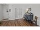 Sun-drenched entryway features beautiful wood-look flooring and charming decor at 1309 Basketweaver Way, Hanahan, SC 29410