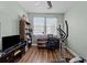 Home office with exercise bike, a bright window, and dark wood furniture at 1309 Basketweaver Way, Hanahan, SC 29410