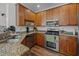 Gourmet kitchen featuring granite counters, a stainless steel oven, and a stainless steel dishwasher at 1309 Basketweaver Way, Hanahan, SC 29410