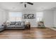 Cozy living space with hardwood floors, neutral walls, and comfortable seating at 1309 Basketweaver Way, Hanahan, SC 29410
