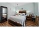 Main bedroom with wood-look flooring, a large bed, and rustic accents at 1309 Basketweaver Way, Hanahan, SC 29410
