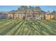 Large backyard featuring a well-maintained lawn, patio and privacy fencing at 131 Kennington Dr, Goose Creek, SC 29445