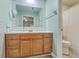 Updated bathroom featuring a wood vanity, white countertops, shiplap accents and tile flooring at 131 Kennington Dr, Goose Creek, SC 29445