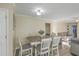 Bright dining room with a wooden table, upholstered chairs, and an open layout to the living space at 131 Kennington Dr, Goose Creek, SC 29445