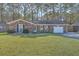 Charming single-story brick home featuring a covered front porch and a well-manicured lawn at 131 Kennington Dr, Goose Creek, SC 29445