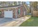 Attached garage with a white door and ample driveway space, complementing the brick exterior at 131 Kennington Dr, Goose Creek, SC 29445