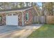 Attached one-car garage with a white door and brick facade, adding functionality and curb appeal at 131 Kennington Dr, Goose Creek, SC 29445