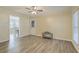 Comfortable living room with laminate floors, neutral walls, and a glimpse into the dining area at 131 Kennington Dr, Goose Creek, SC 29445