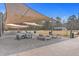 Outdoor picnic area with tables, ping pong and shade canopies, creating a relaxed and social gathering space at 131 Kennington Dr, Goose Creek, SC 29445
