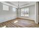 Bright dining room featuring wood floors, large windows, and elegant chandelier at 134 Palfrey Dr, Ridgeville, SC 29472