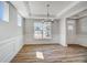 Elegant dining room with decorative trim, chandelier and plentiful natural light at 134 Palfrey Dr, Ridgeville, SC 29472