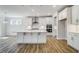 Spacious kitchen with stainless steel appliances, a center island and abundant natural light at 134 Palfrey Dr, Ridgeville, SC 29472