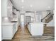 Well-lit kitchen featuring a center island, stainless steel appliances, and an open floor plan at 134 Palfrey Dr, Ridgeville, SC 29472