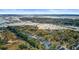 Picturesque aerial view of waterfront homes surrounded by lush trees and scenic marshlands at 1450 Eutaw Battalion Dr, Charleston, SC 29412