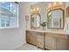 Bathroom featuring dual vanities, mirrors, and modern finishes at 1450 Eutaw Battalion Dr, Charleston, SC 29412