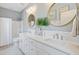 Bright bathroom features a dual sink vanity with marble countertops and modern fixtures at 1450 Eutaw Battalion Dr, Charleston, SC 29412