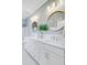 Bright bathroom features a dual sink vanity with marble countertops and modern fixtures at 1450 Eutaw Battalion Dr, Charleston, SC 29412