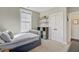 Nicely appointed bedroom with natural light, simple shelving, and room to grow at 1450 Eutaw Battalion Dr, Charleston, SC 29412