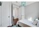 Light and airy bedroom with ensuite entrance, multiple closets, and colorful light fixture at 1450 Eutaw Battalion Dr, Charleston, SC 29412