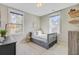 Cozy bedroom filled with natural light and featuring a twin bed and neutral decor at 1450 Eutaw Battalion Dr, Charleston, SC 29412