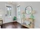 Inviting foyer with hardwood floors, stylish console table, and abundant natural light at 1450 Eutaw Battalion Dr, Charleston, SC 29412