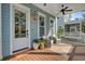 Relax on this front porch with outdoor furniture, ceiling fans, and 'Home Sweet Home' doormat at 1450 Eutaw Battalion Dr, Charleston, SC 29412