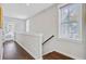Upstairs hallway with multiple windows and doorways to rooms at 1450 Eutaw Battalion Dr, Charleston, SC 29412