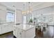 Open-concept kitchen flowing into the dining and living areas, featuring an island and modern appliances at 1450 Eutaw Battalion Dr, Charleston, SC 29412