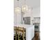Well-lit kitchen featuring stainless steel appliances, a central island, and hardwood floors at 1450 Eutaw Battalion Dr, Charleston, SC 29412