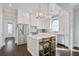 Modern kitchen with stainless steel appliances, white cabinetry, and a large island with seating at 1450 Eutaw Battalion Dr, Charleston, SC 29412