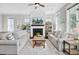 Comfortable living room with fireplace, ceiling fan, and views of the surrounding neighborhood at 1450 Eutaw Battalion Dr, Charleston, SC 29412
