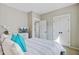 Stylishly decorated main bedroom with plush bedding and a convenient dresser with TV at 1450 Eutaw Battalion Dr, Charleston, SC 29412
