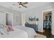Spacious main bedroom with ceiling fan, TV, and walk-in closet at 1450 Eutaw Battalion Dr, Charleston, SC 29412