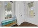 Mud room with bench storage, view of a bright window, and exterior door at 1450 Eutaw Battalion Dr, Charleston, SC 29412