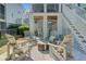 Inviting outdoor patio with comfortable seating and a cozy fire pit, perfect for entertaining guests at 1450 Eutaw Battalion Dr, Charleston, SC 29412