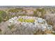 Wide aerial shot of a residential community with a central park and surrounding trees at 1651 Valley Oak Rd, Johns Island, SC 29455