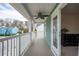 Cozy covered balcony with white railings and a ceiling fan, providing a relaxing outdoor space at 1651 Valley Oak Rd, Johns Island, SC 29455