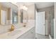 Modern bathroom with double sinks, white vanity, and decorative mirrors at 1651 Valley Oak Rd, Johns Island, SC 29455