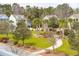 Lush community with palm trees, green lawns, and charmingly designed houses at 1651 Valley Oak Rd, Johns Island, SC 29455