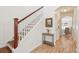 Charming foyer featuring hardwood floors, a staircase, and a decorative painting at 1651 Valley Oak Rd, Johns Island, SC 29455
