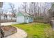 Detached garage with lush green lawn and a fenced perimeter at 1651 Valley Oak Rd, Johns Island, SC 29455